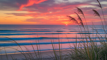 Serene Sunset over Ocean Waves and Beach Grass