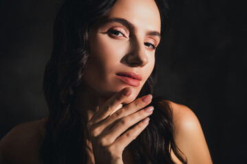 Fototapeta premium Photo of pretty chic lady look touch face chin feel flirty tempting under sun light over dark color background