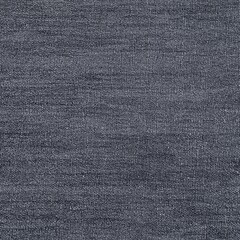 Gray textured fabric surface closeup with detailed weave pattern