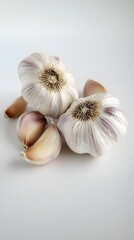 Fresh Garlic: This shot features a group of fresh garlic bulbs, exhibiting intricate textures, with individual cloves artfully arranged, ideal for culinary enthusiasts and health-conscious consumers.