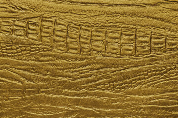 Crocodile genuine leather structure texture macro, yellow colored leatherette surface with...