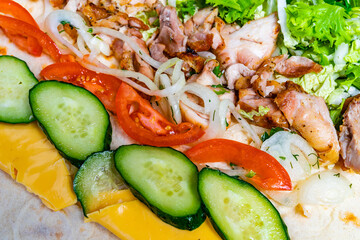 Delicious wrap filled with grilled chicken and fresh vegetables