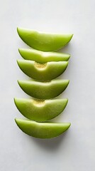 Melon Slices: A refreshing and vibrant arrangement of fresh green melon slices, cut and presented in a simple, yet elegant display