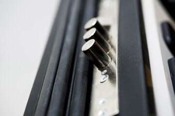 Close-up of a door bolt lock mechanism. A detailed macro shot of a metallic bolt lock on a security...
