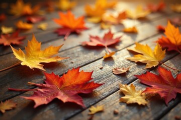 Warm autumn leaves scattered on hardwood floor, wood texture, leaf