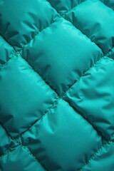 Close-up quilted turquoise sleeping bag Diamond stitch texture , fabric, turquoise