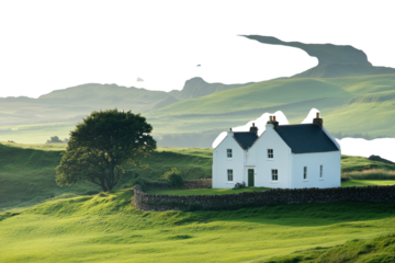 Charming white cottage surrounded by lush green hills and dramatic cliffs under soft sunlight