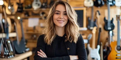 Fototapete Musikladen friendly female entrepreneur standing in music instrument store   © Brian