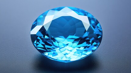 Blue topaz gemstone with intricate faceting, glowing under a focused light source.