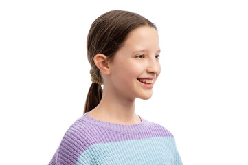 A young girl with a ponytail smiling against a white background.