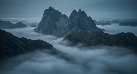 Majestic Mountain Peaks Emerging from Misty Cloudscape