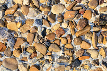 A close up of a rock surface with many different sized rocks