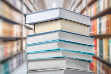 stack of old reading books on background