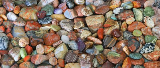 A Focus Stacked Close-up Panorama Image of Collection of Tumbled Rocks Found on the Shore of Lake...