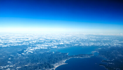Aerial View of Mountainous Terrain and Coastline