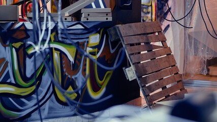 Grungy graffiti paint art on derelict building walls done by underground guerilla artists. Close up...