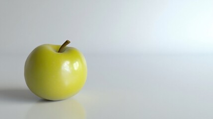 Green apple on white background, studio shot, minimalist