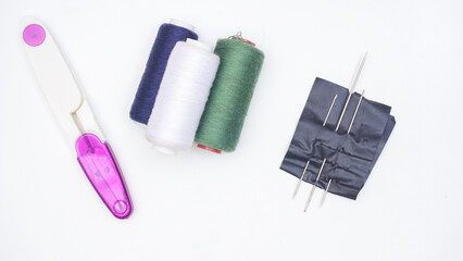 Sewing tools and supplies isolated on white background