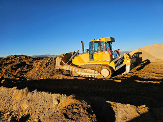 Obraz premium Heavy bulldozer machinery working on bulkearthworks
