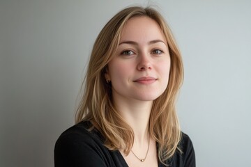 Fototapeta premium Portrait of a young woman with natural beauty and soft expression