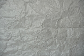 White crumpled paper texture background.