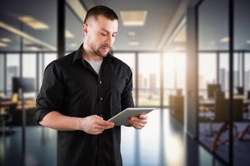 Fototapeta premium Businessman portrait hold tablet computer in office