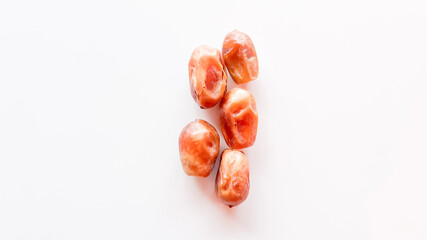 Dried dates palm fruit isolated on white background.