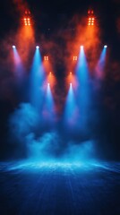 Vibrant stage lighting with blue and orange spotlights shining through mist, creating a dramatic and cinematic atmosphere for performances or events.
