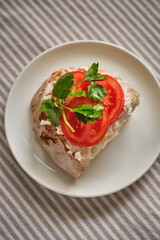 toast with krill spread, tomatoes and cilantro