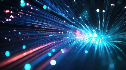 Fototapeta premium Vibrant light signals travel through high-speed fiber optic cables in a dark setting, highlighting the rapid transmission of data in a digital network.