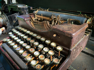 Old rusty antique typewriter on the table