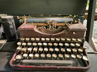 Old rusty antique typewriter on the table