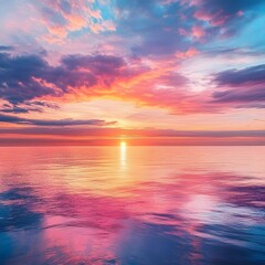 Obraz premium Vibrant Pink And Purple Sunset Over Calm Ocean Water