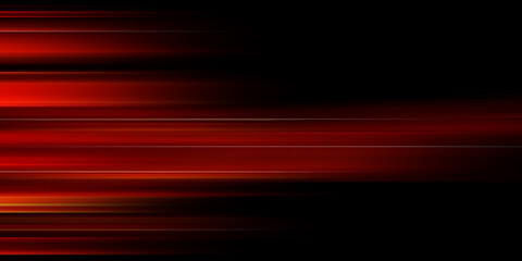 The effect of red light in fast motion on a black background. blurred abstract background with long exposure. neon light