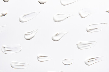 A white pristine smear isolated on white background,  Creamy skincare product swatch 