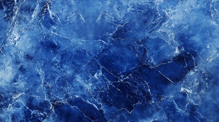 The wall features a beautiful abstract grunge decorative dark navy blue stone texture with a rough indigo blue marble background