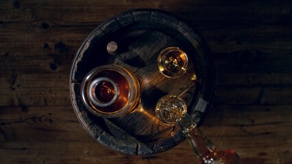 Detail of pouring whiskey into drink. Freeze motion of drink preparation.