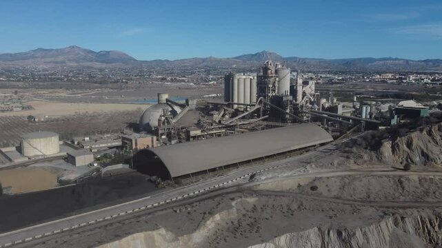 Flying along a huge cement plant and quarry