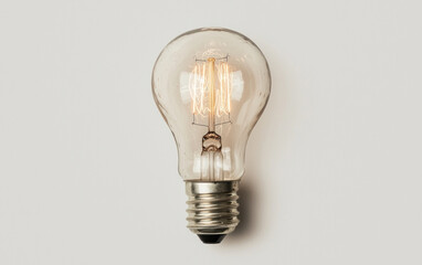 Glowing Vintage Lightbulb on Gray Background