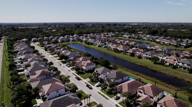 Aerial: West Palm Beach residential zone during the day, push in drone shot, USA