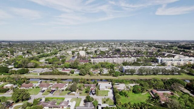 Aerial: West Palm Beach residential zone during the day, dolly in drone shot, USA