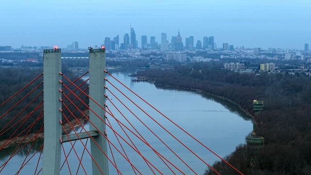 Siekierkowski bridge over the vistula river with warsaw skyline in view, aerial view