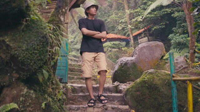 Man Walking Down Stone Stairs in Tropical Nature