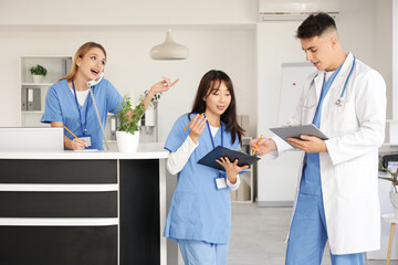 Medical interns working near reception in clinic