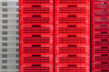 Red and white professional boxes for merchandise stored on a factory warehouse