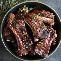 Succulent BBQ Pork Ribs on a Black Plate
