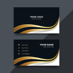 Elegant gold-accented business card design on dark background