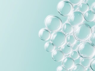 A collection of delicate, transparent bubbles clustered on the right side of a soft aqua background. 
