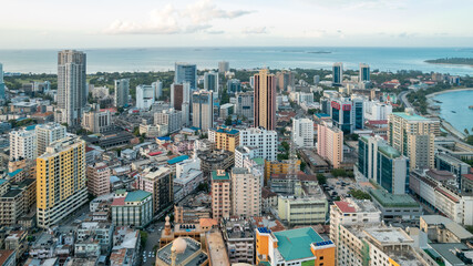 A breathtaking aerial drone shot of Dar Es Salaam, capturing the city's vibrant skyline, bustling...