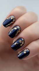Exquisite Nail Art: A Symphony of Gold and Deep Blue, a testament to stylish elegance and creative expression in nail design.